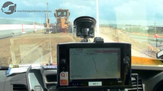 Windscreen-mounted displays show cut/fill levels and design features.