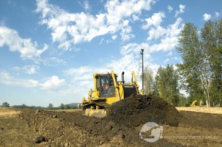 Komatsu 65PX dozer with machine guidance